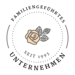 Siegel mit einer Rose, umgeben vonm Text: Familiengeführtes Unternehmen seit 1995